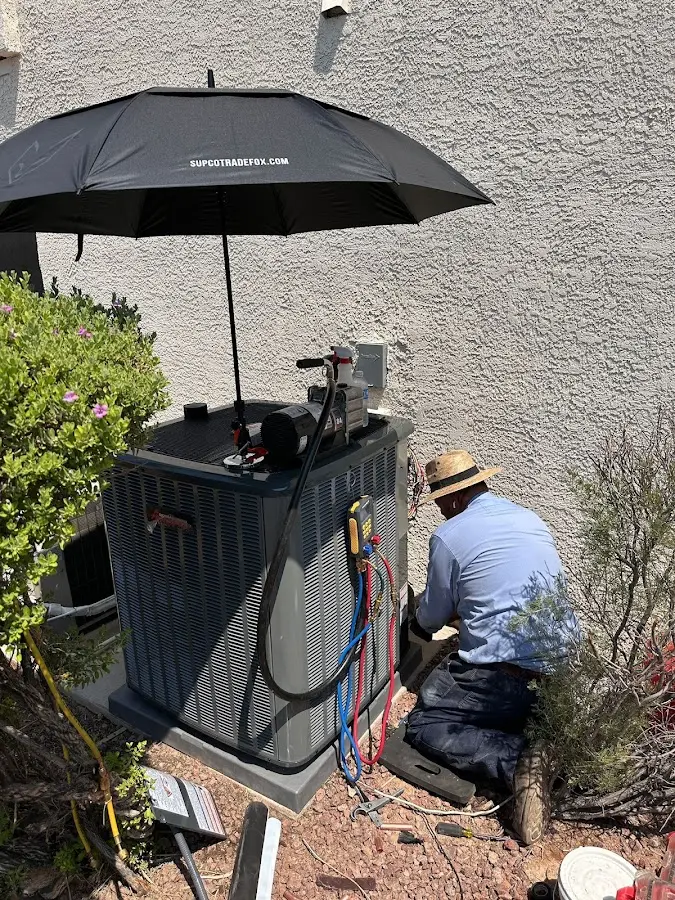 HVAC technician performing outdoor AC maintenance in Smithtown